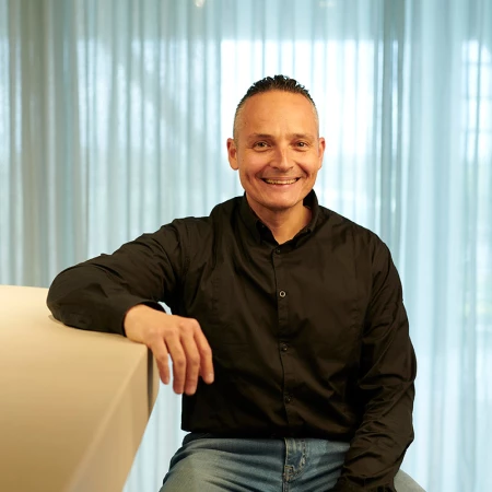 Giovanni, technical manager at Lamett, is sitting at the bar in the showroom.
